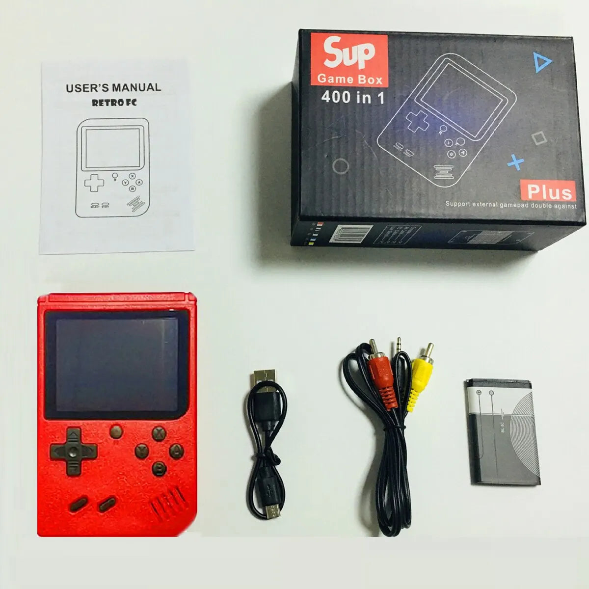 Red handheld gaming console with accessories on a white background