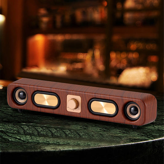 Wooden speaker on a dark surface with a blurred background