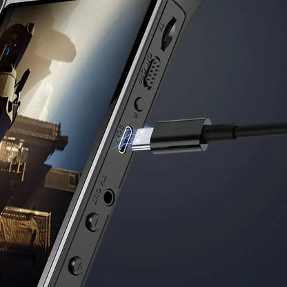 Close-up of a smartphone with a USB-C cable connected, screen displaying an image.