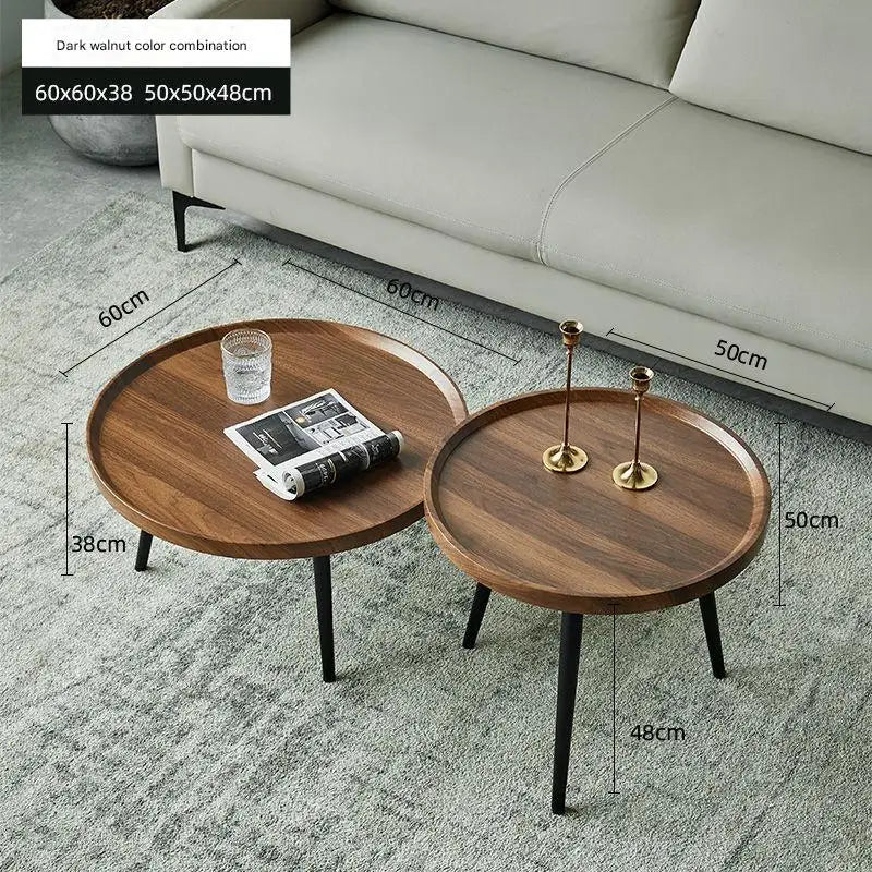 Two wooden coffee tables with dimensions displayed on a gray carpet.