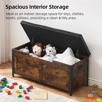 Wooden storage trunk with toys and clothes on a wooden floor, text about spacious interior storage.