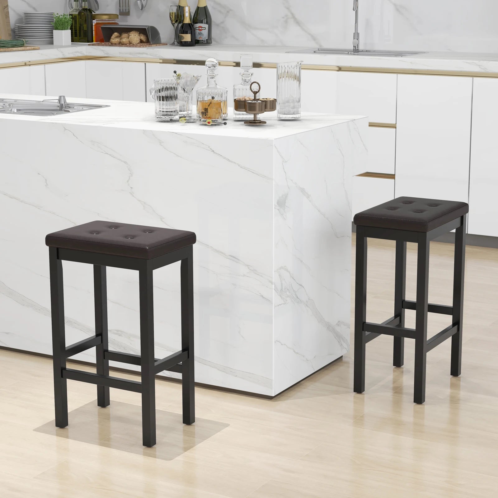 Two black bar stools in front of a white kitchen island.