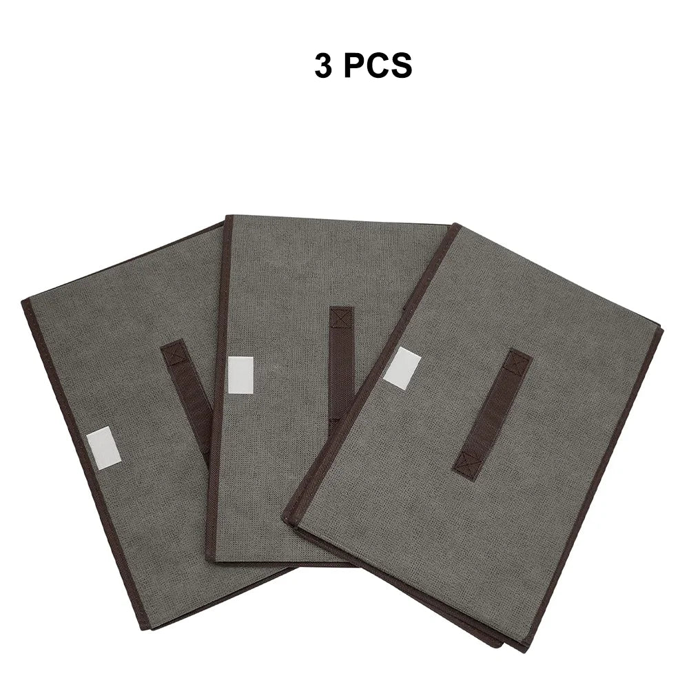 Three gray fabric covers with brown edges on a white background