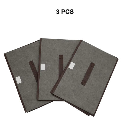 Three gray fabric covers with brown edges on a white background