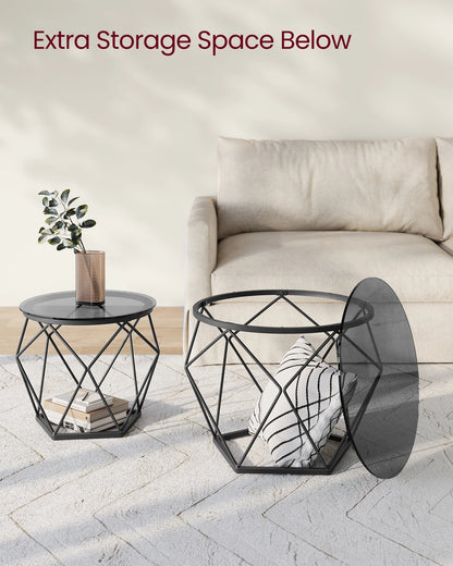 Modern black geometric side table with extra storage space below, placed in a living room setting.