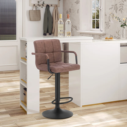 Brown bar stool in front of a white kitchen island with bottles and decor.