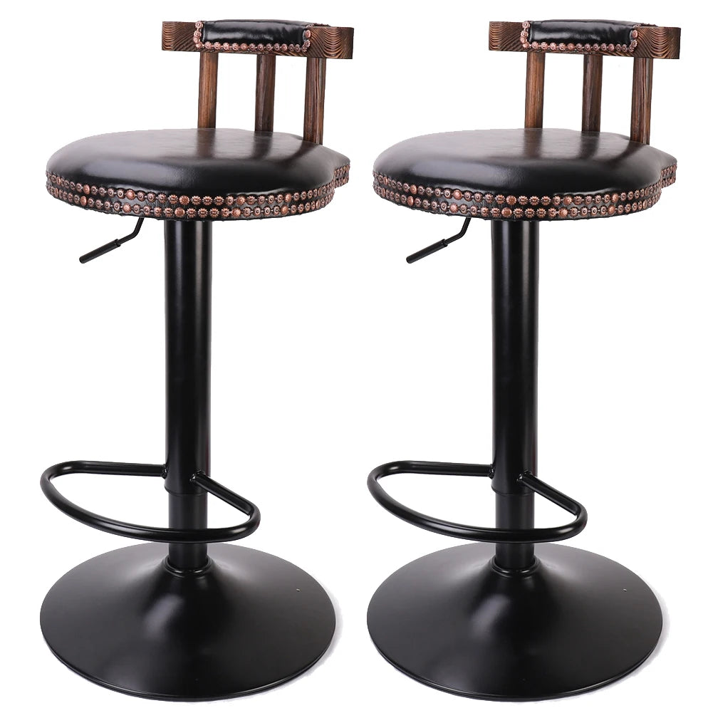 Two black bar stools with brown leather seats on a white background