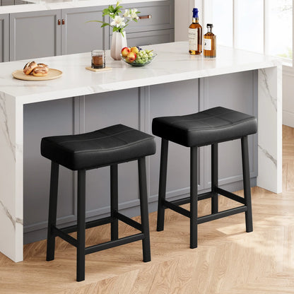 Two black bar stools in front of a kitchen island with marble countertop.