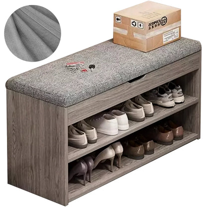 Wooden shoe bench with gray cushion and shoes on a white background