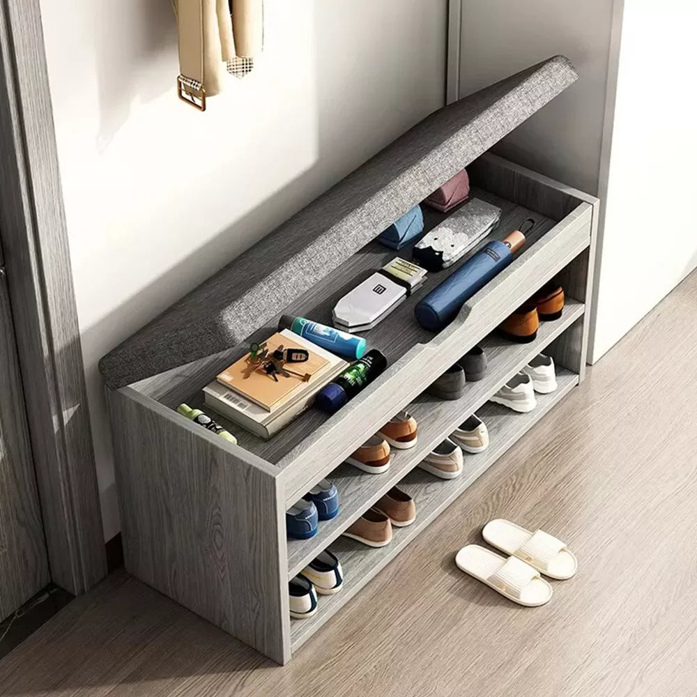 Shoe rack with various shoes and items on a wooden floor.