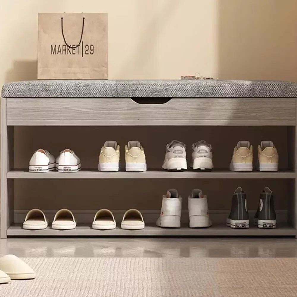 Shoe rack with various shoes on a neutral background