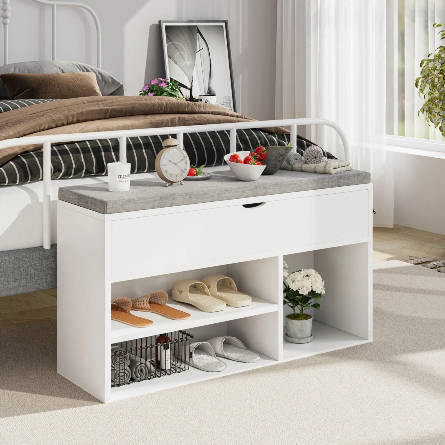 White shoe storage bench with gray top in a bedroom setting