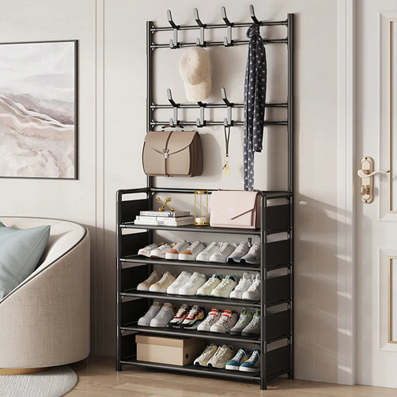 Shoe rack with multiple shelves holding shoes, bags, and a scarf in a room setting.