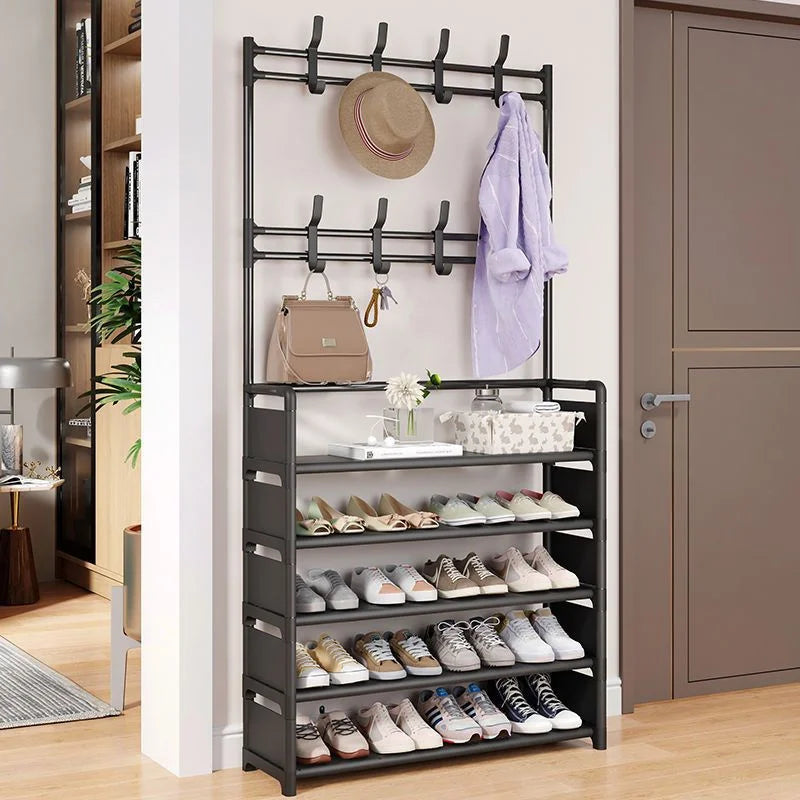 Shoe rack with multiple shelves holding shoes, a hat, and a handbag in a room setting.