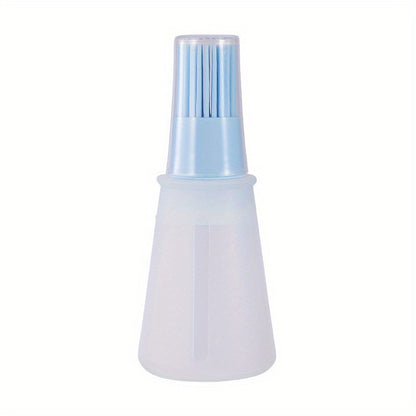 White spray bottle with blue nozzle on a white background