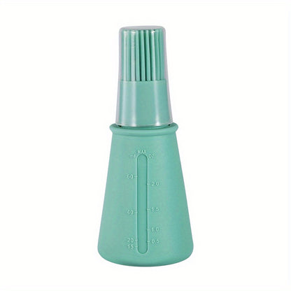 Green bottle with a brush attachment on a white background
