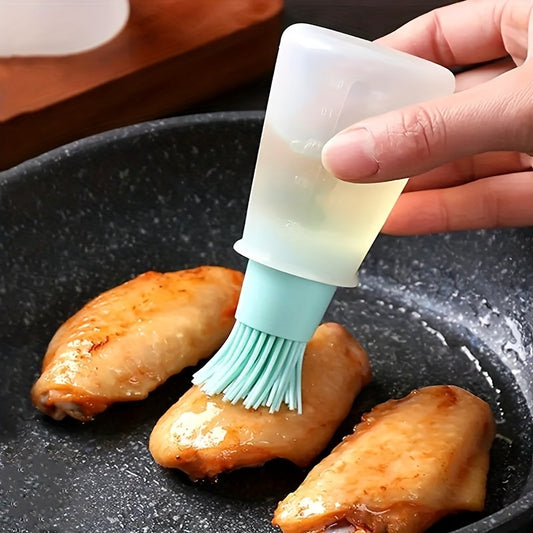 Person using a silicone basting brush to apply sauce to chicken wings on a pan.