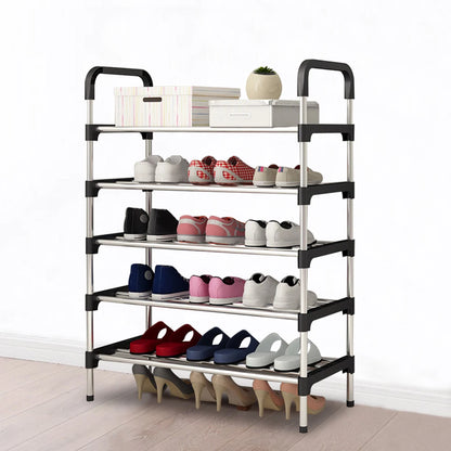 Multi-tiered shoe rack with various shoes on a white background
