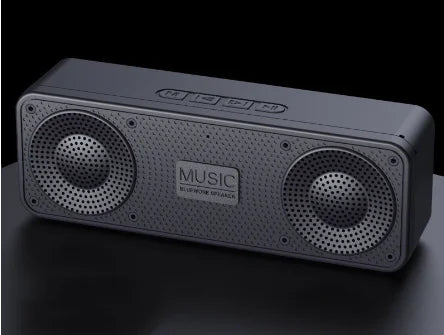Gray Bluetooth speaker with 'Music' branding on a black background