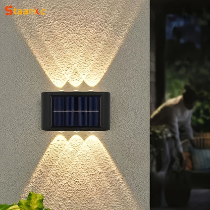 Solar wall light fixture on a textured wall with a blurred background
