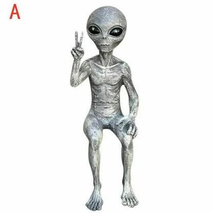 Alien figure making a peace sign on a white background