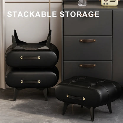 Black stackable storage unit with ottoman in a room setting