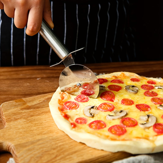 Person cutting a pizza with pepperoni and mushrooms using a pizza cutter on a wooden board.