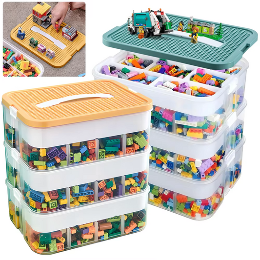 Stackable toy storage containers with colorful building blocks and a small model on a green baseplate.