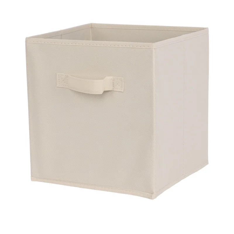 Beige storage box with a handle on a white background