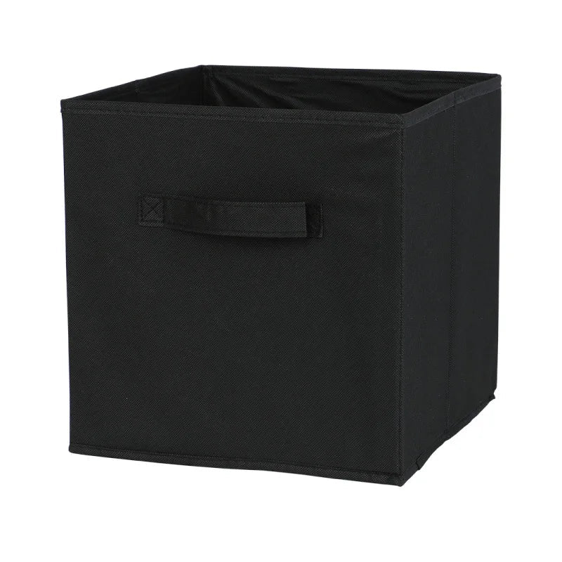 Black storage cube with a handle on a white background