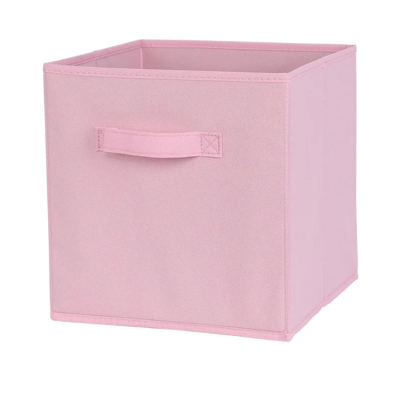 Pink storage box with a handle on a white background