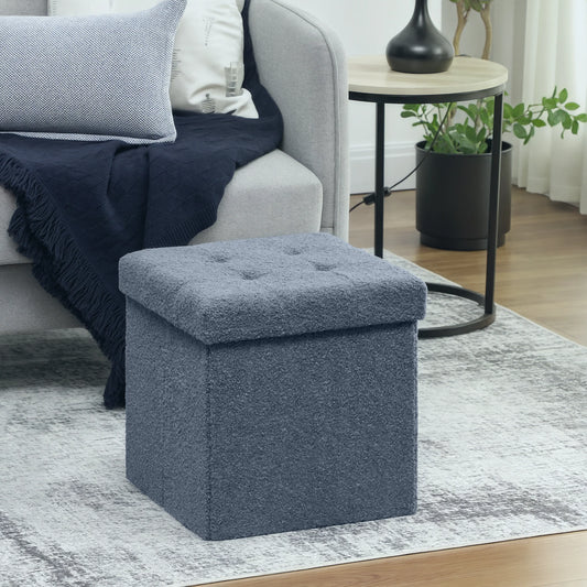 Blue ottoman in a living room setting with a sofa and side table.