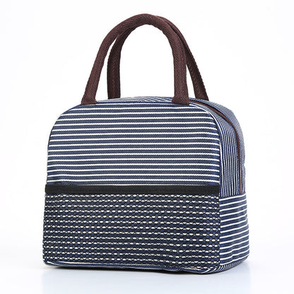 Navy and white striped bag with brown handles on a white background