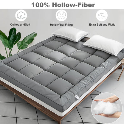 Gray mattress topper on a bed with text highlighting features like hollow-fiber filling.