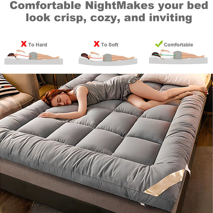 Woman lying on a bed with a gray mattress topper, demonstrating comfort levels.