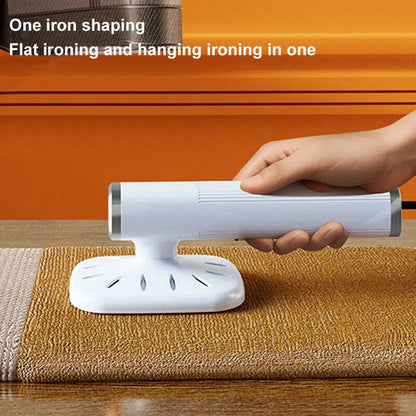 Hand holding a white iron on a brown towel with an orange background