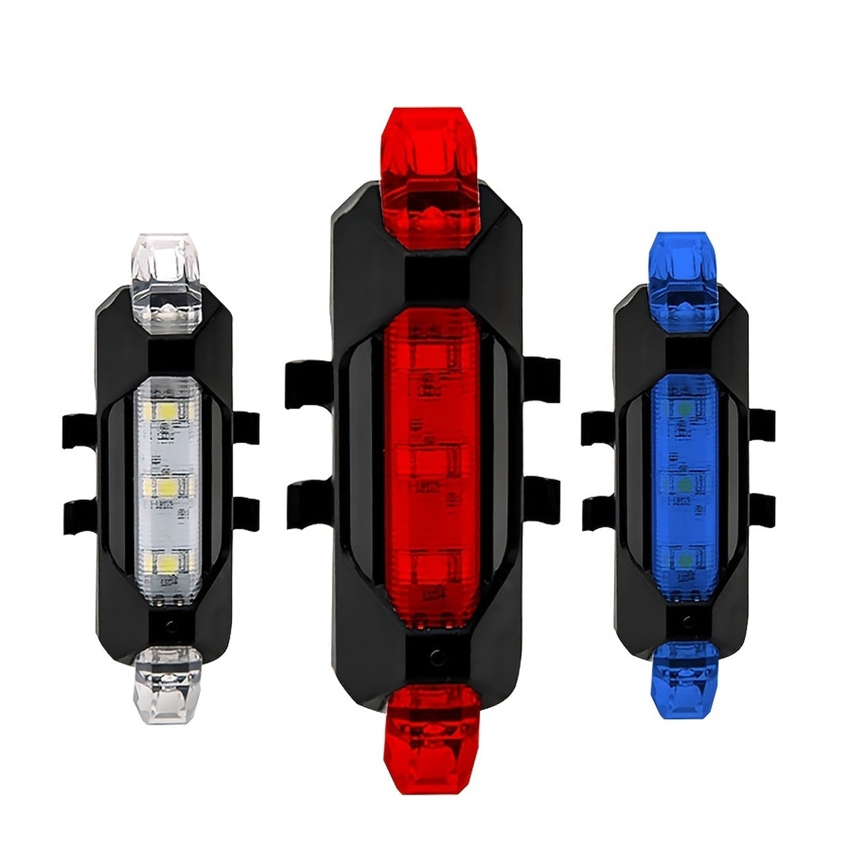Three bicycle lights in red, blue, and clear on a white background