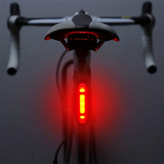 Bicycle tail light on a dark background