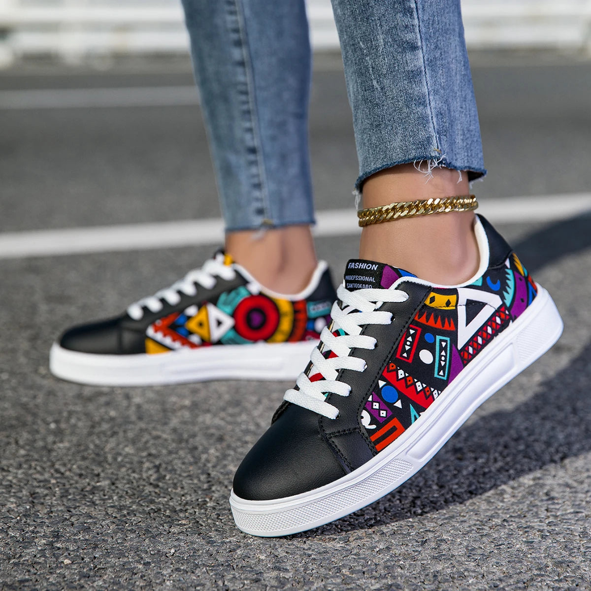 Colorful sneakers with geometric patterns worn on a street.