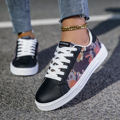 Black and floral sneakers worn on a street