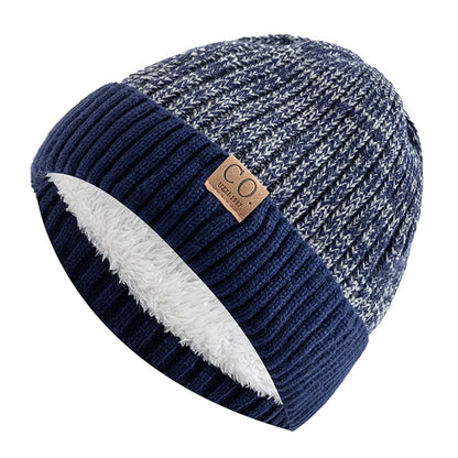 Blue and gray knit beanie with white interior on a white background
