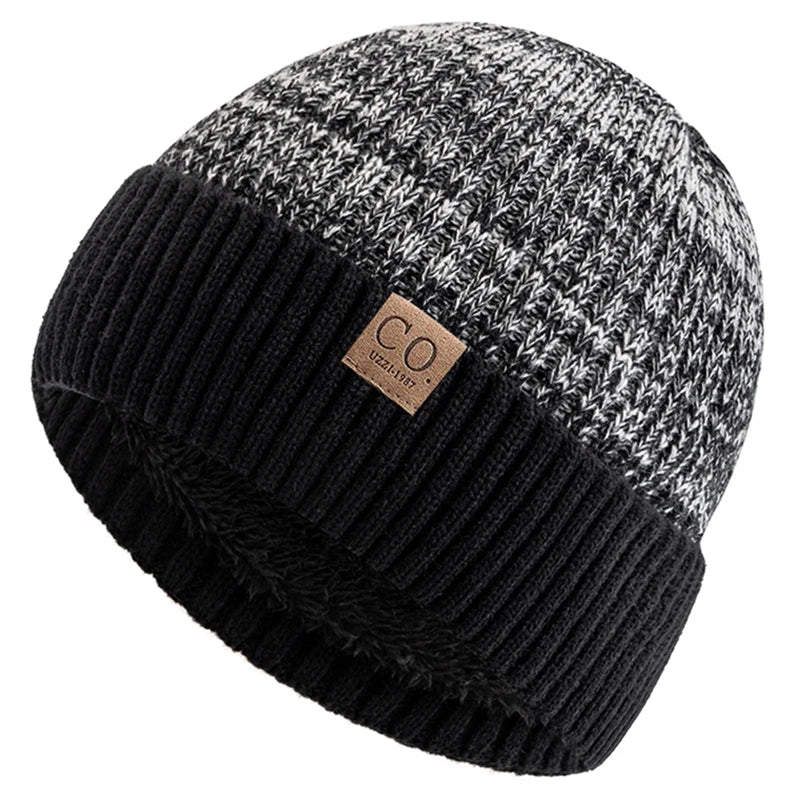 Knitted beanie with black and gray pattern and a brand label on a white background