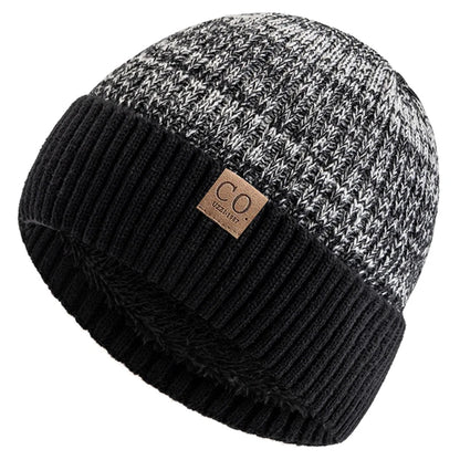 Knitted beanie with black and gray pattern and a brand label on a white background