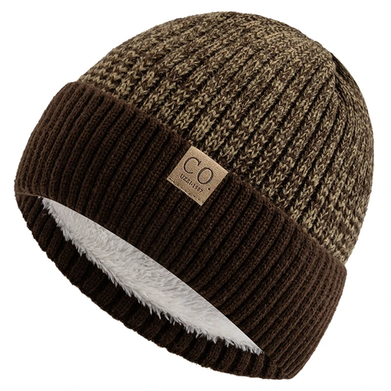 Brown knit beanie with a brand logo on a white background