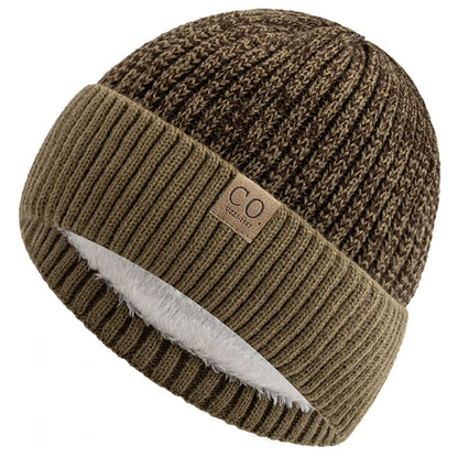 Brown knit beanie with a brand label on a white background