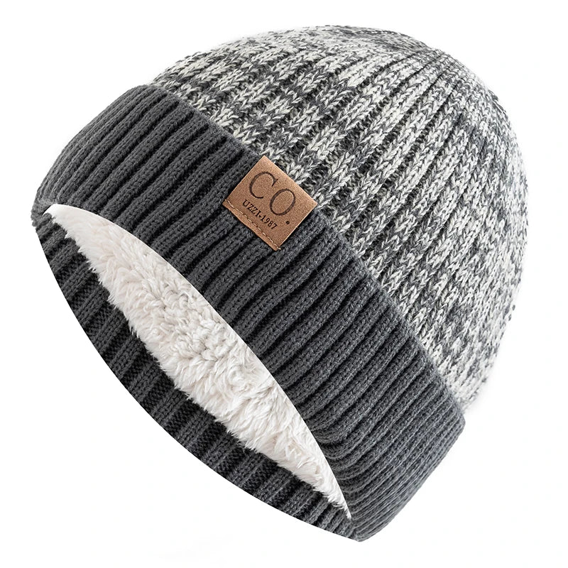 Knitted beanie with a brown label on a white background