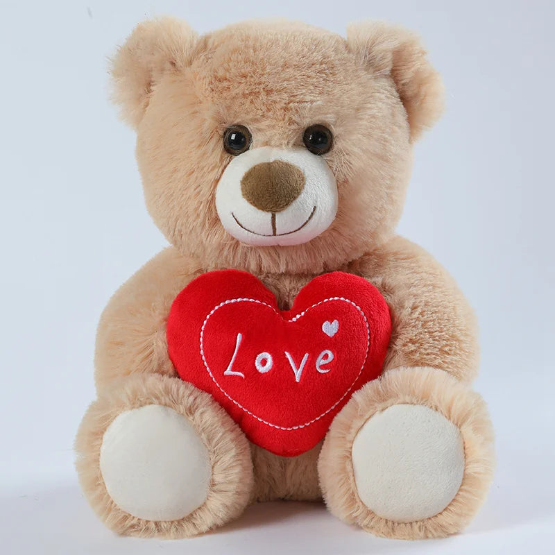 Teddy bear holding a red heart with 'Love' on a white background
