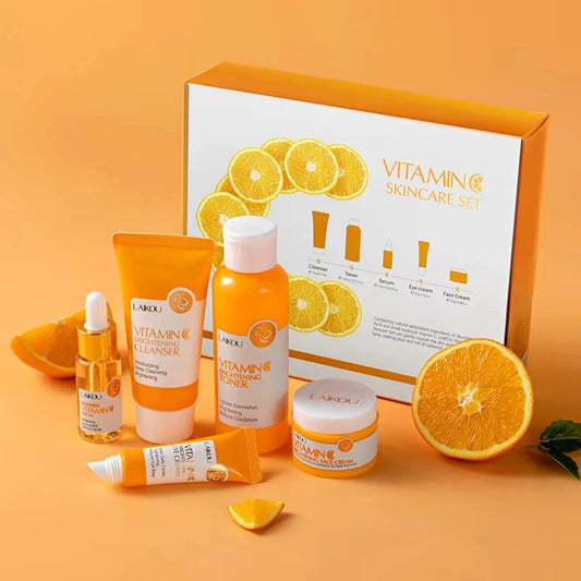 Lakou Vitamin C skincare set with orange-themed packaging on an orange background