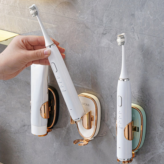 Electric toothbrushes with suction cups on a gray wall
