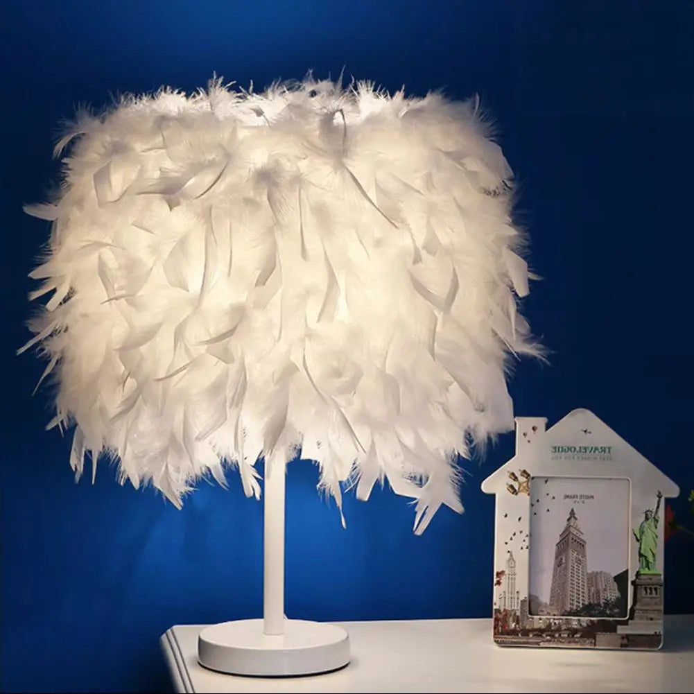 Feathered lamp on a white surface with a blue background